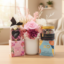 Load image into Gallery viewer, Pink floral hamper in cheerful setting without board