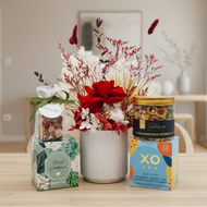 Red floral gift hamper in homely setting